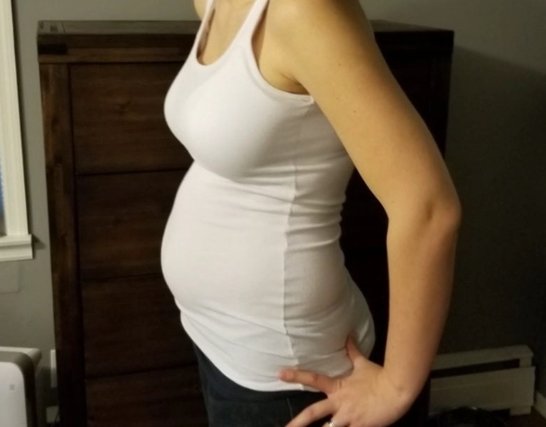 when do you show in pregnancy first baby